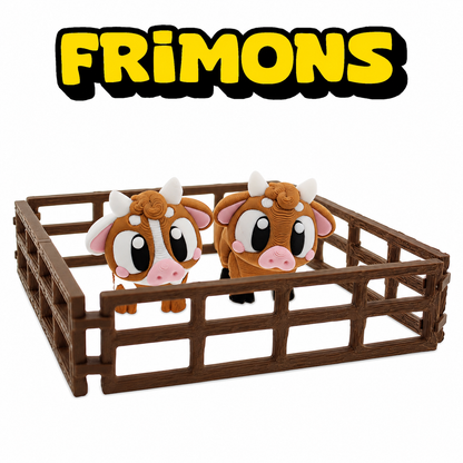 Set van twee koefiguren in een rechthoekig houten hek